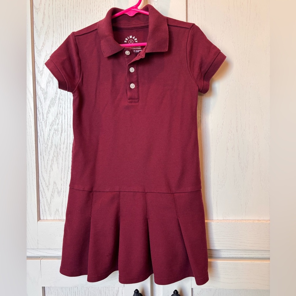The Primary maroon short sleeve polo dress uniform